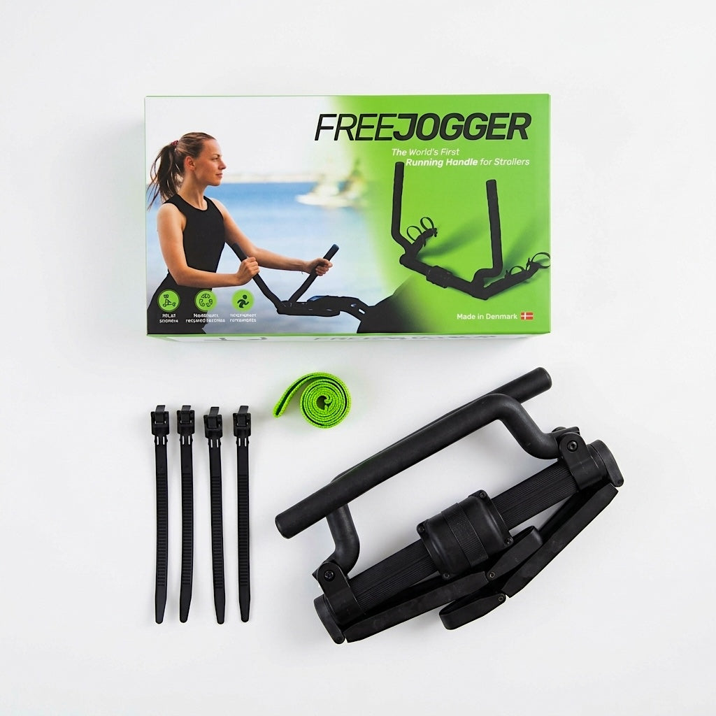Image of FREEJOGGER pack shot showing the packagin, the FREEJOGGER running handle, the green safety wrist strap, and 4 black straps, all viewed from above